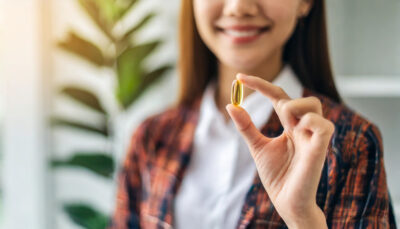 womans hand holding medical pill capsule focusing fingertips image conveys themes